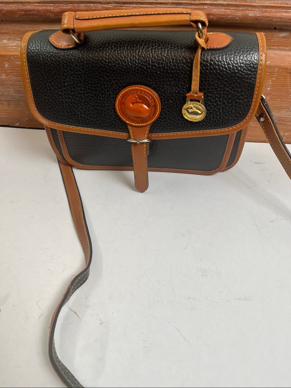 Dooney & Bourke Black Pebble Leather Messenger with Brown Trim